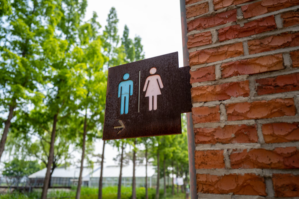 Customizable Outdoor Directional Restroom Signs by Saltwater Signworks