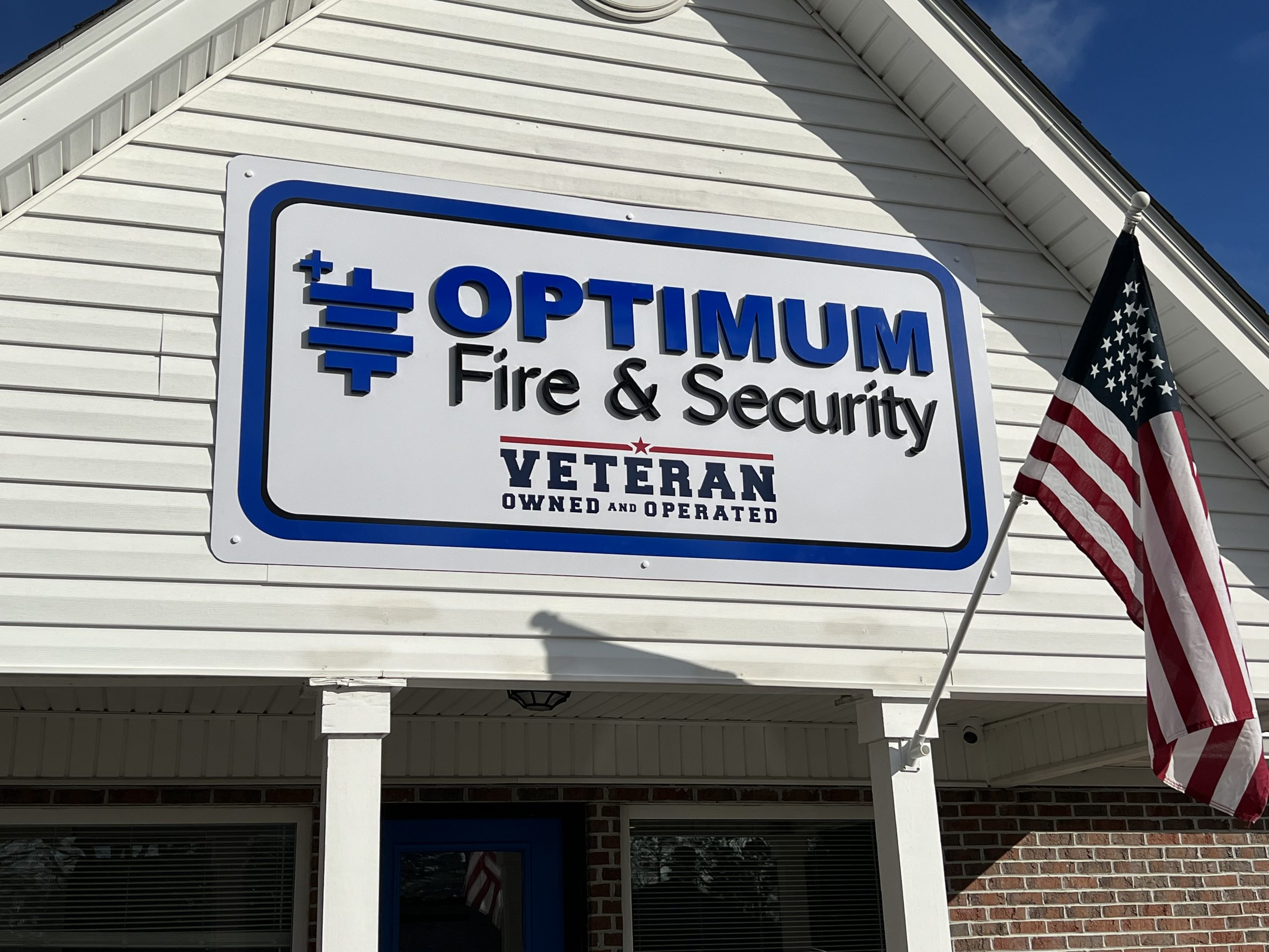 Custom outdoor sign of Optimum Fire & Security business