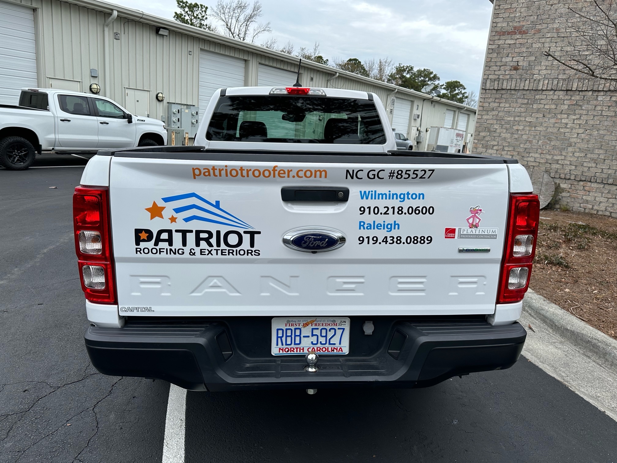 Vinyl lettering and graphics on Roofing & Exteriors Truck
