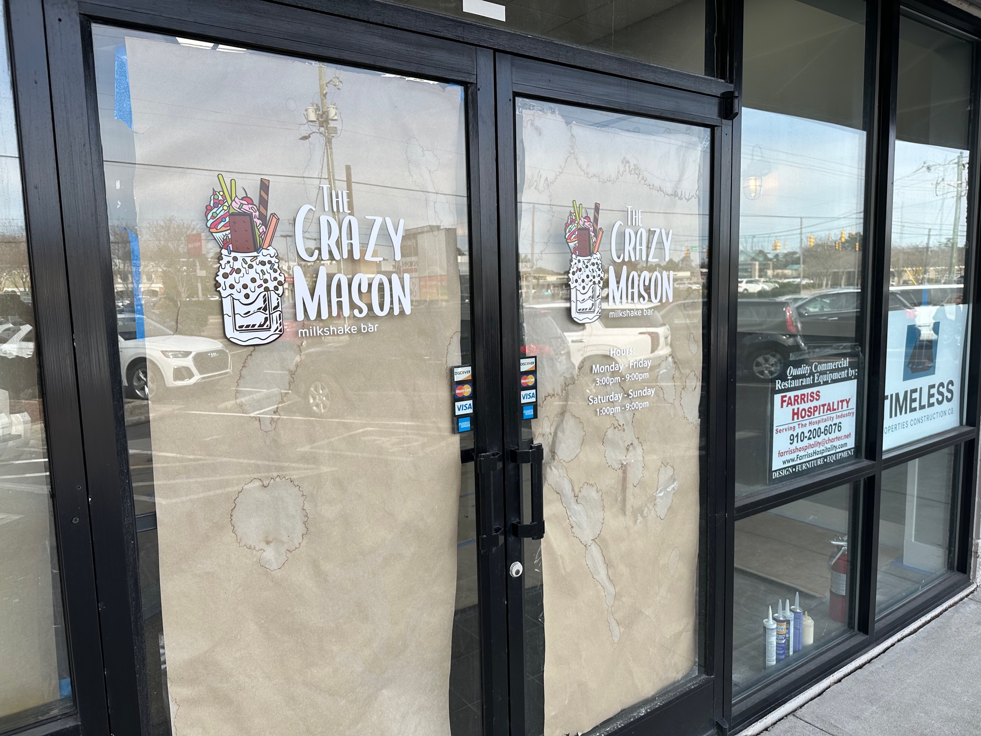 Vinyl lettering and graphics on door for Crazy Mason Bar in Wilmington, NC